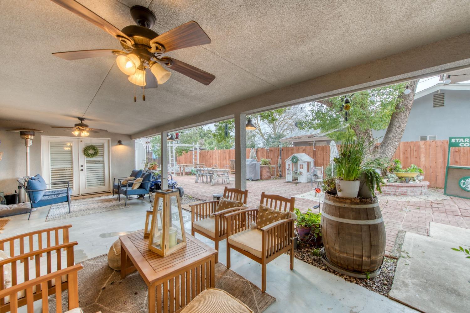 1880 East Cardella Street Firebaugh, CA 93622 - Photo 31 of 42 a living room with furniture and a large window