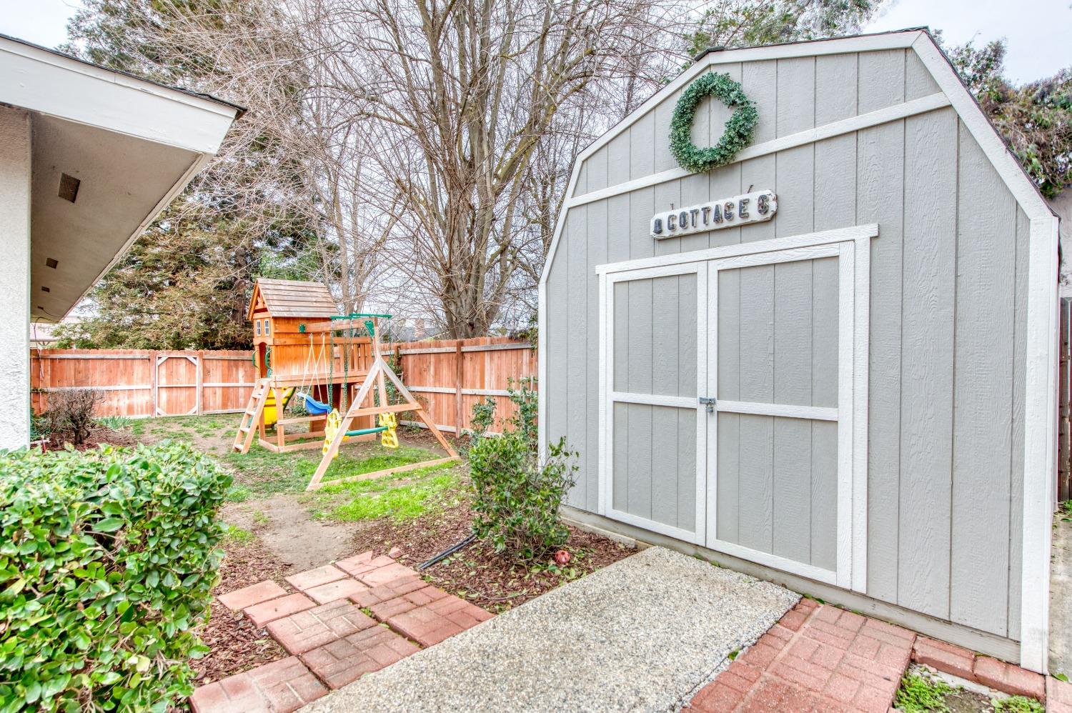 1880 East Cardella Street Firebaugh, CA 93622 - Photo 36 of 42 a view of a street with potted plants