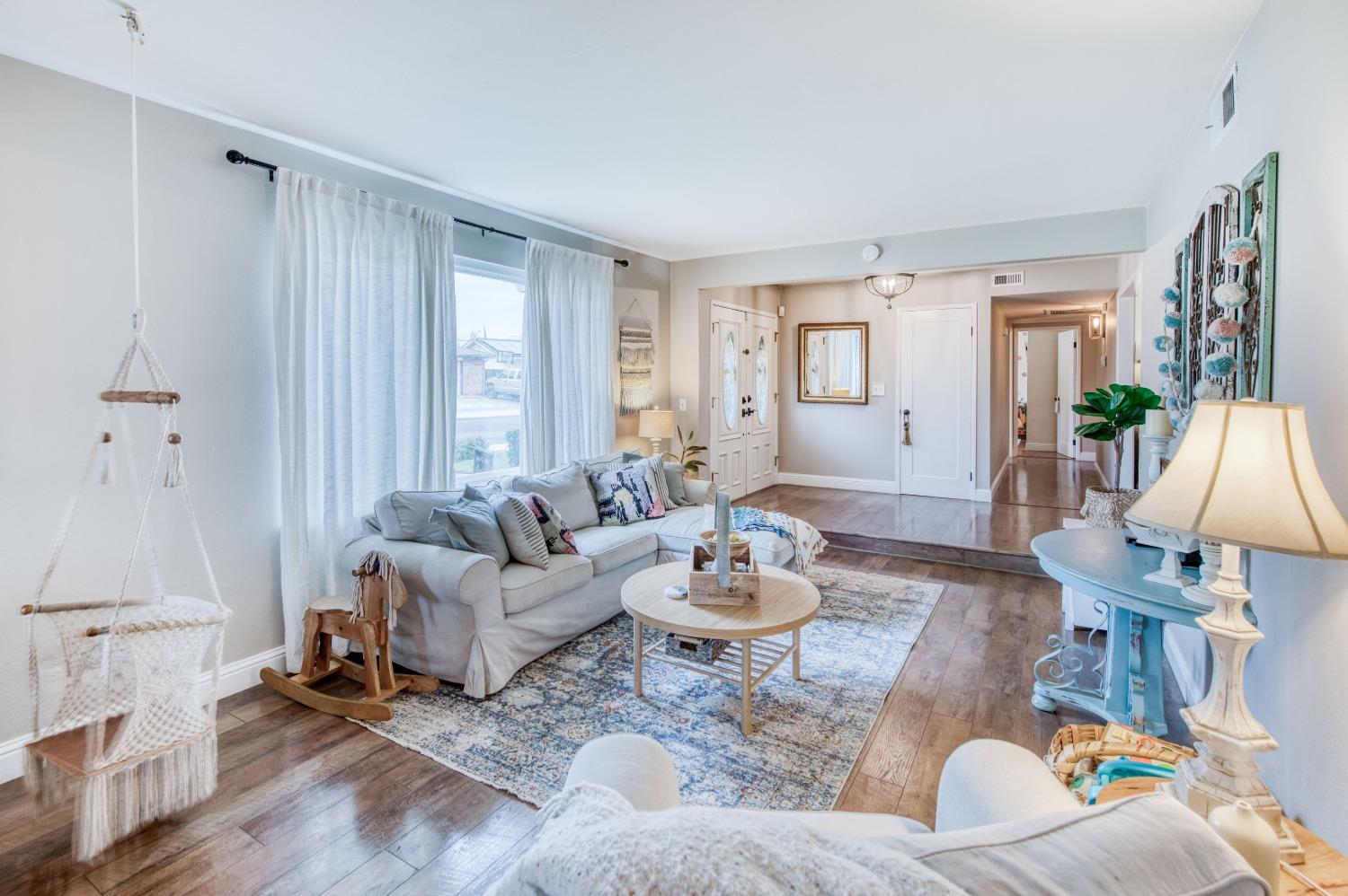 1880 East Cardella Street Firebaugh, CA 93622 - Photo 5 of 42 a living room with furniture and wooden floor