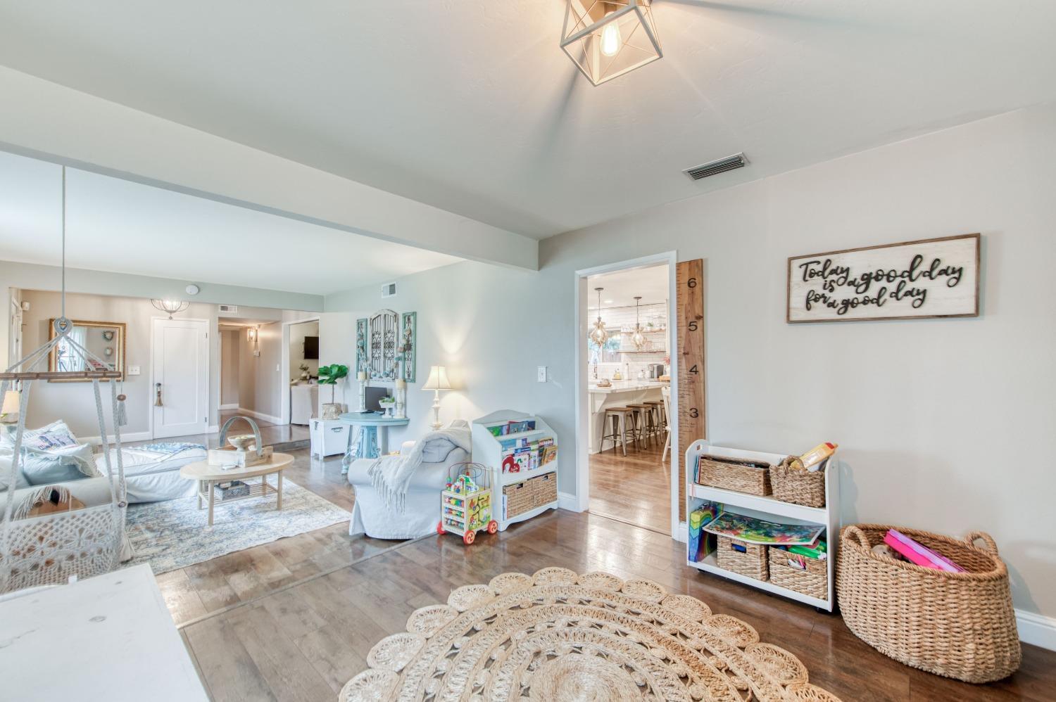 1880 East Cardella Street Firebaugh, CA 93622 - Photo 6 of 42 a living room with furniture and a table