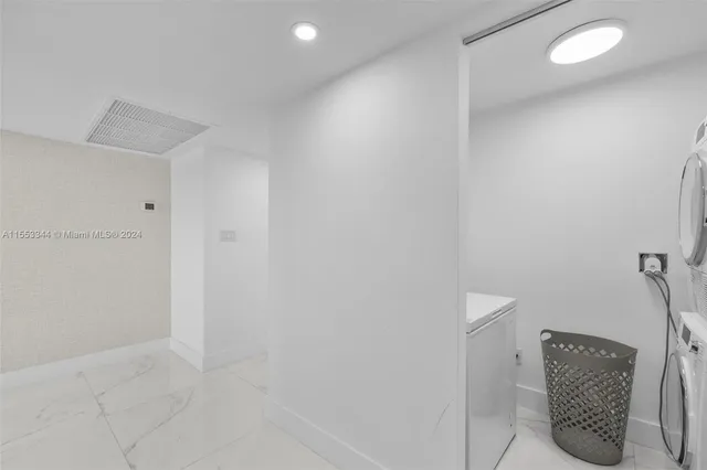 a bathroom with a toilet a sink and shower