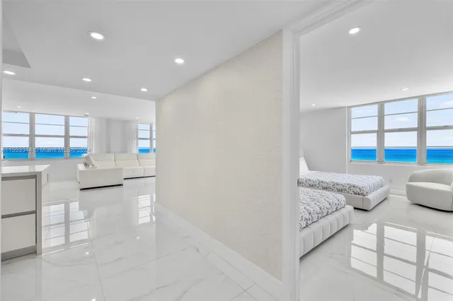 a bedroom with two beds and a window