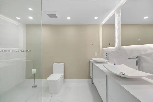 a view of a chairs and table in backyard of the house