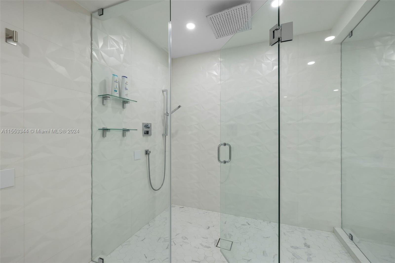 5151 Collins Avenue, Unit 1527 Miami Beach, FL 33140 - Photo 43 of 65 a bathroom with a shower