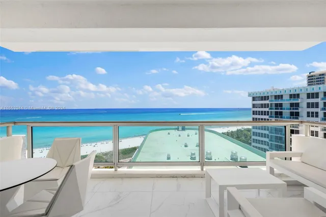 a view of a living room and floor to ceiling window
