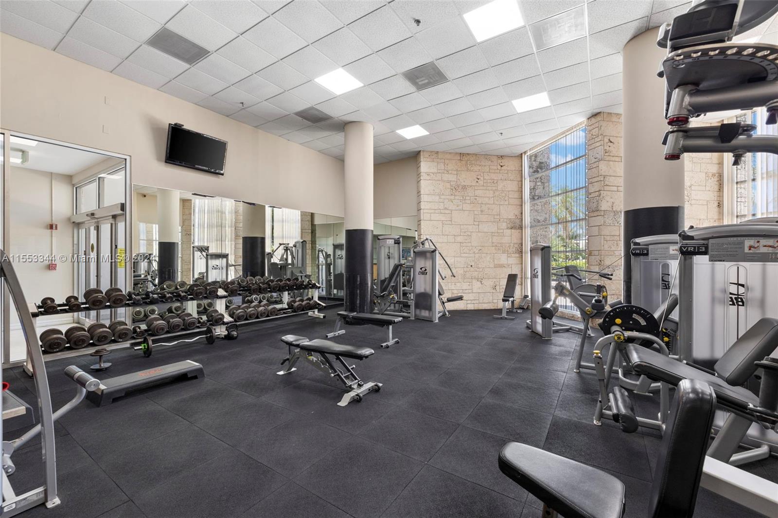 5151 Collins Avenue, Unit 1527 Miami Beach, FL 33140 - Photo 49 of 65 a view of a room with gym equipment