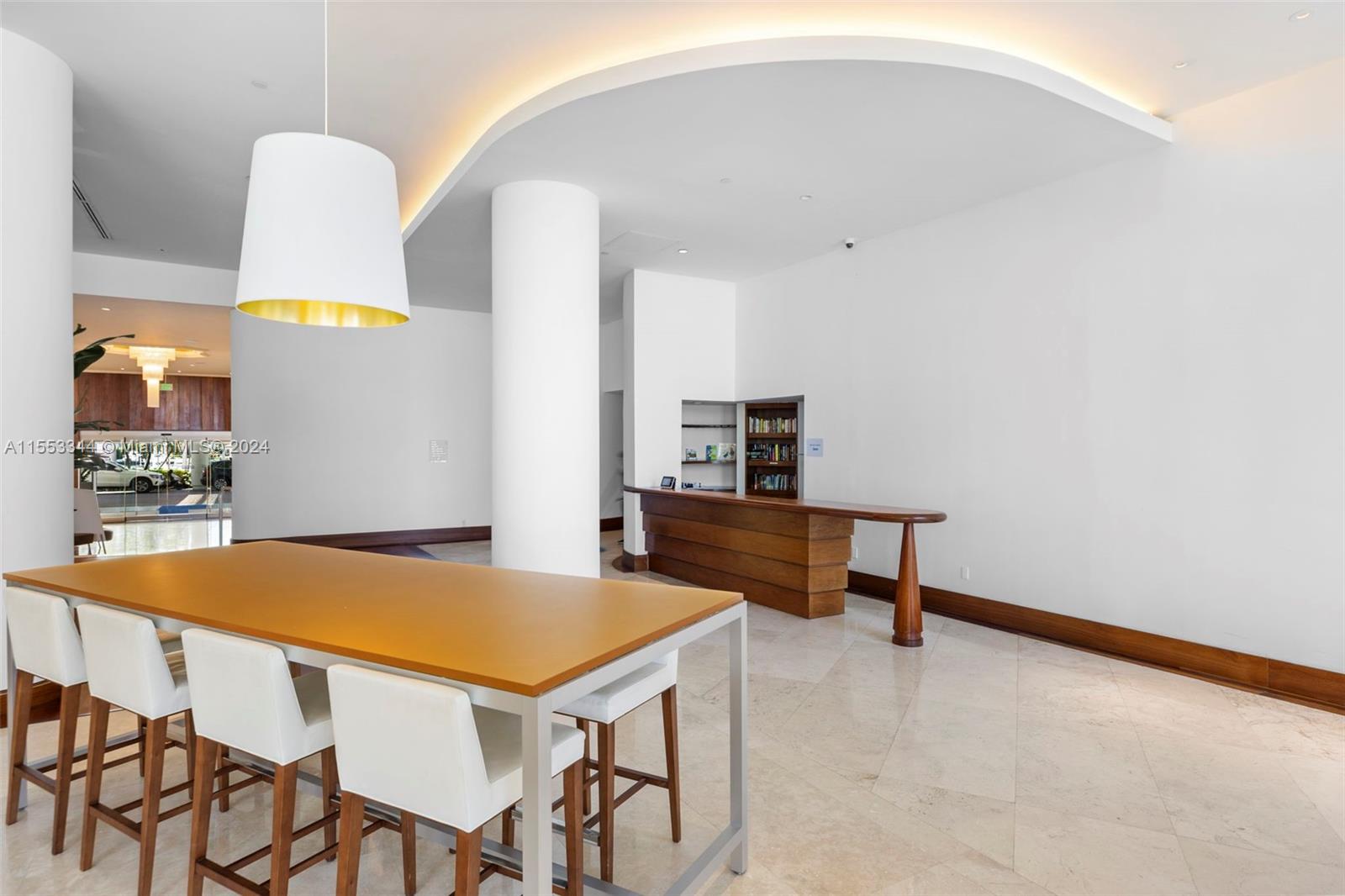 5151 Collins Avenue, Unit 1527 Miami Beach, FL 33140 - Photo 59 of 65 a view of a dining room with furniture and wooden floor