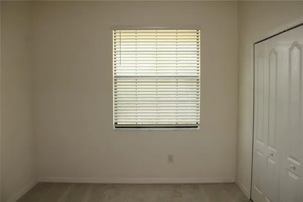 a view of a room that has a window in it