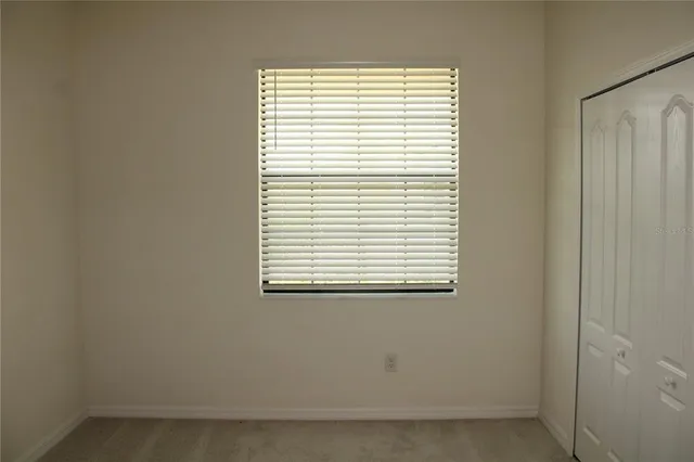 a view of a room that has a window in it