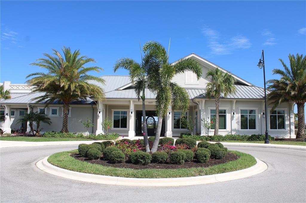 6647 Clairborne Lane Bradenton, FL 34211 - Photo 29 of 39 a front view of a house with garden