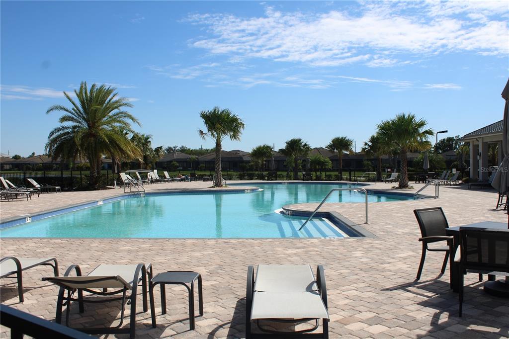 6647 Clairborne Lane Bradenton, FL 34211 - Photo 34 of 39 a view of a lake with table and chairs