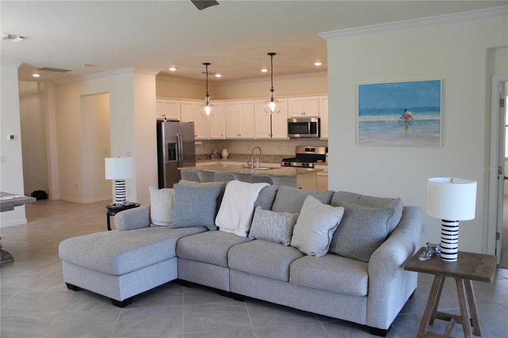 6647 Clairborne Lane Bradenton, FL 34211 - Photo 7 of 39 a living room with furniture and a wooden floor
