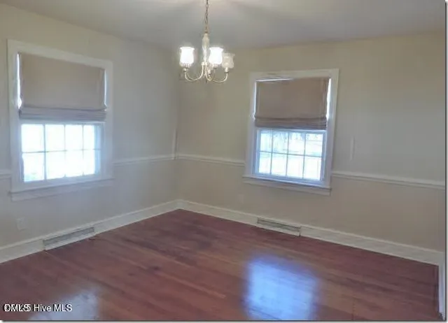 a view of a windows and a chandelier in a room