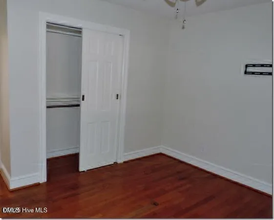 a view of a small space with wooden floor