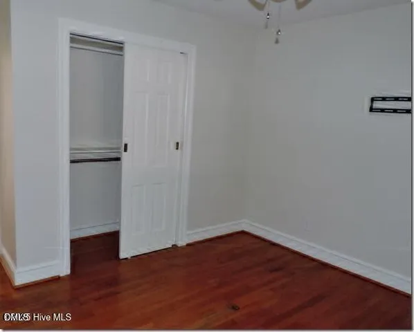 a view of a small space with wooden floor