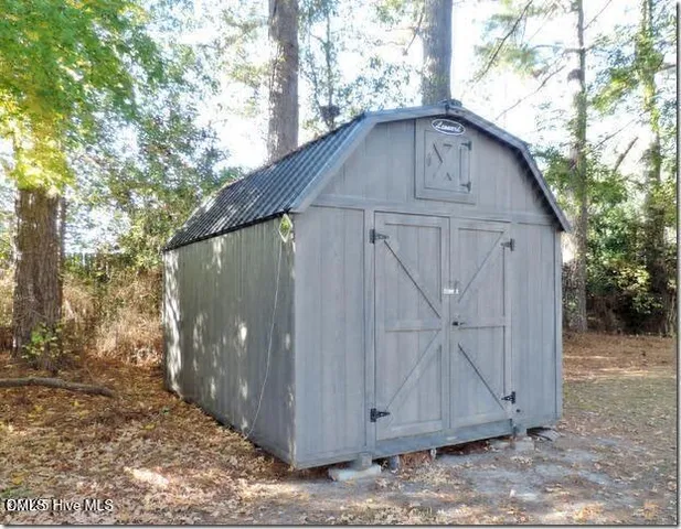 a view of a yard and tree