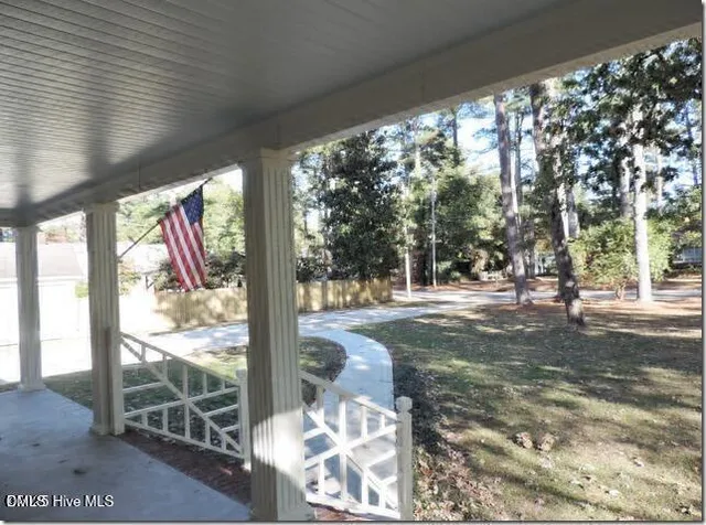a view of a yard with street from next to a road