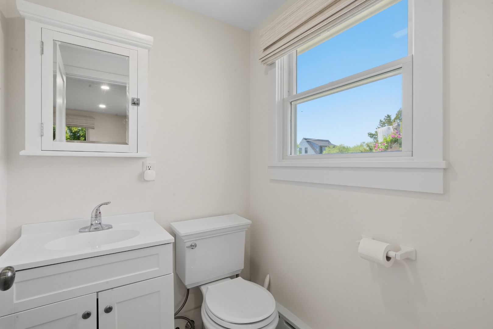 3 Newtown Road Nantucket, MA 02554 - Photo 11 of 20 a bathroom with a toilet sink and mirror