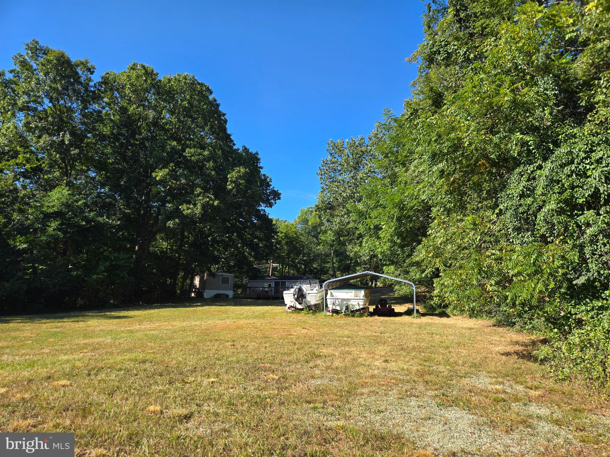 6721 Old Plank Road Broad Top, PA 16621 - Photo 13 of 18 a front view of a house with a yard