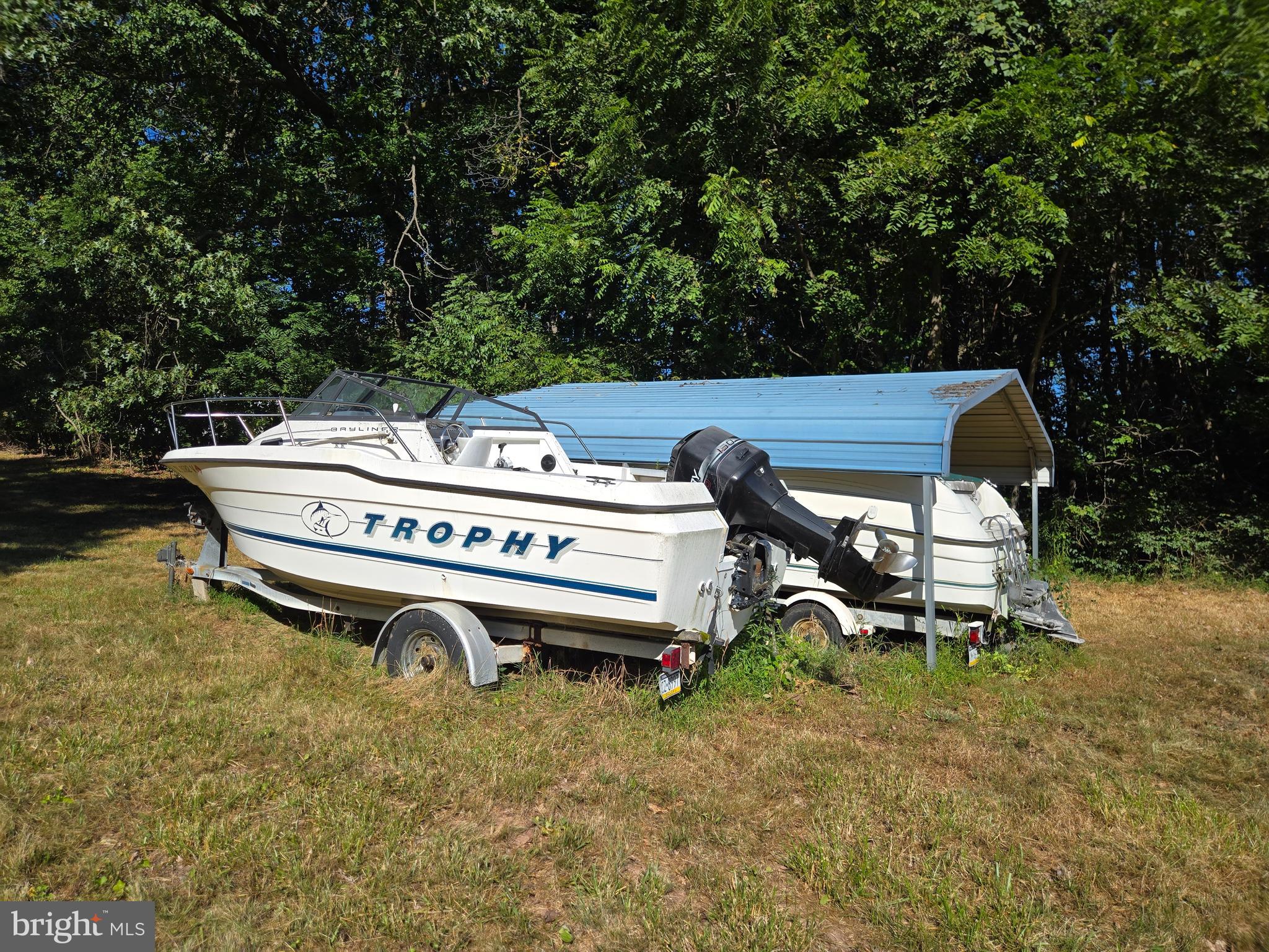 6721 Old Plank Road Broad Top, PA 16621 - Photo 15 of 18 a backyard of a house with yard and outdoor seating