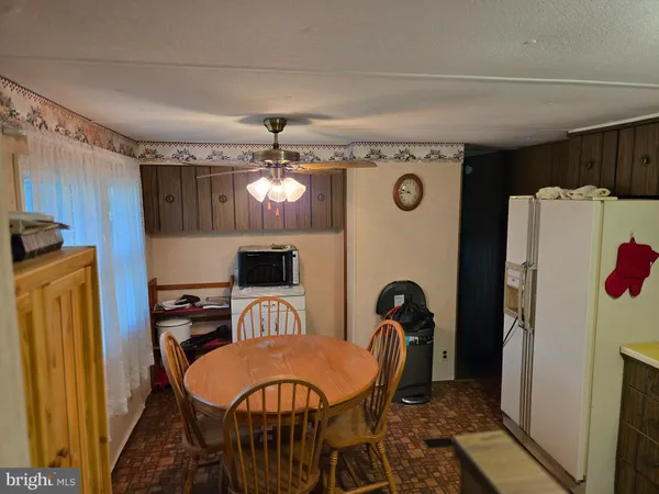 a dining room with furniture and window