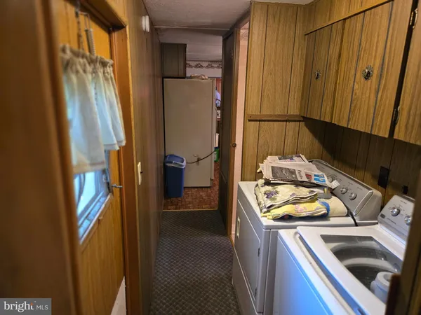 a kitchen that has a sink stove and refrigerator