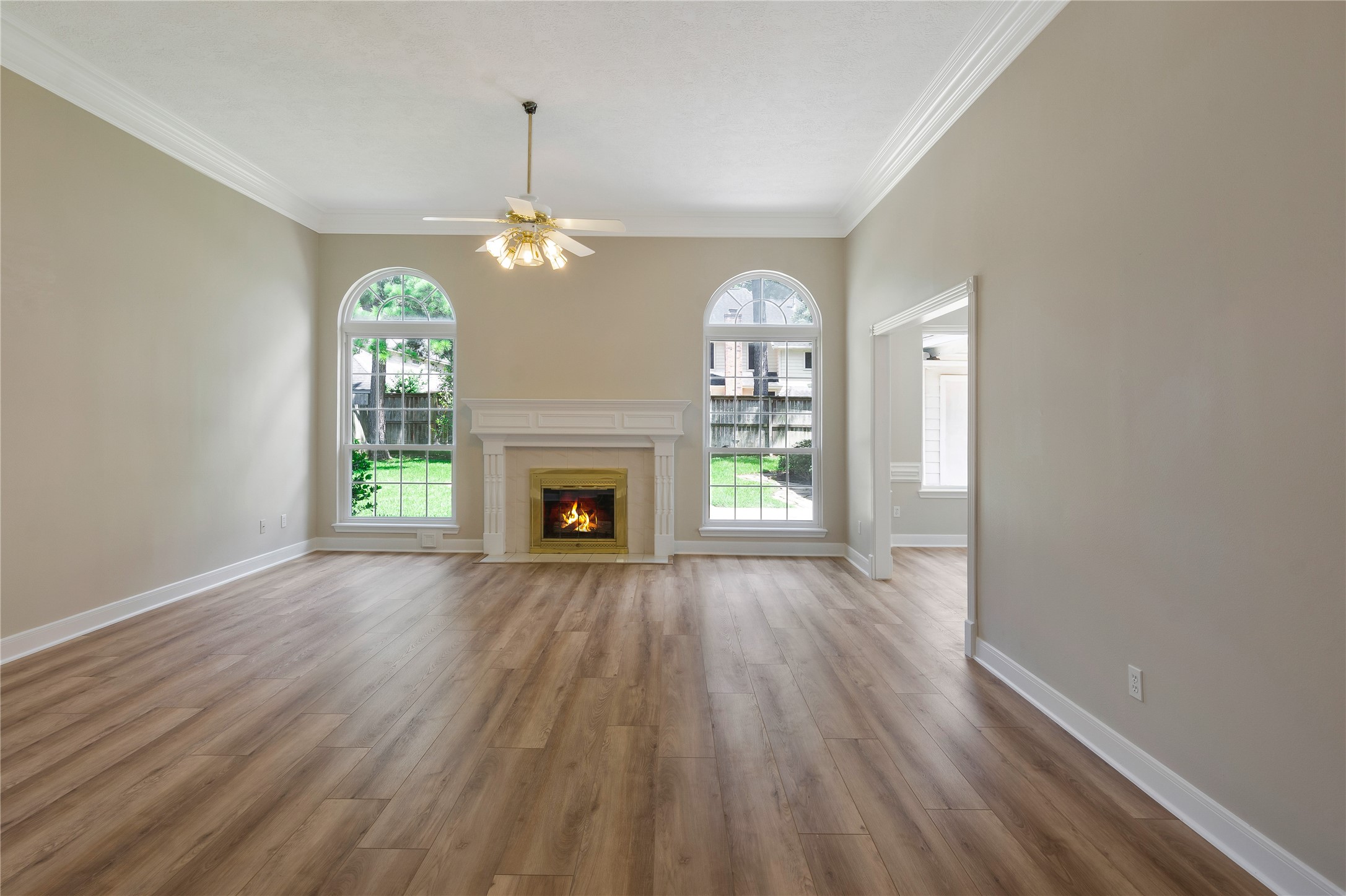 8011 Null Court Spring, TX 77379 - Photo 11 of 41 Large Living Room features gas fireplace and floor to ceiling windows.