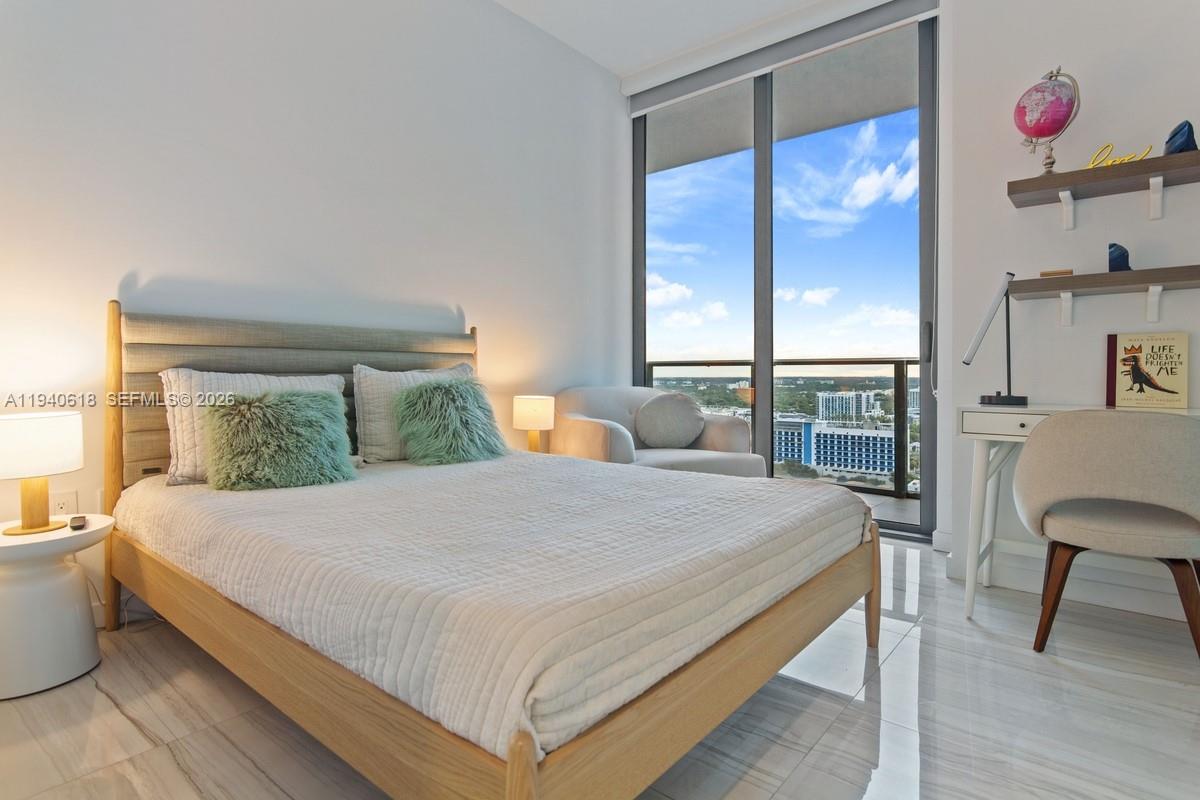 480 Northeast 31st Street, Unit 2307 Miami, FL 33137 - Photo 14 of 47 a bedroom with a bed and a window
