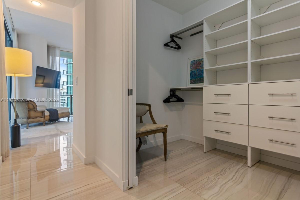480 Northeast 31st Street, Unit 2307 Miami, FL 33137 - Photo 18 of 47 a view of a bedroom with furniture and closet