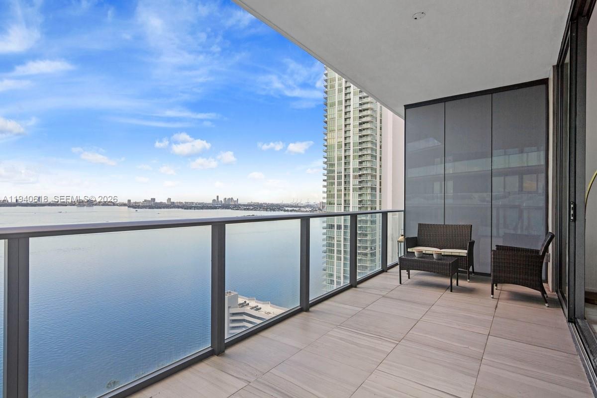 480 Northeast 31st Street, Unit 2307 Miami, FL 33137 - Photo 2 of 47 a terrace with outdoor seating