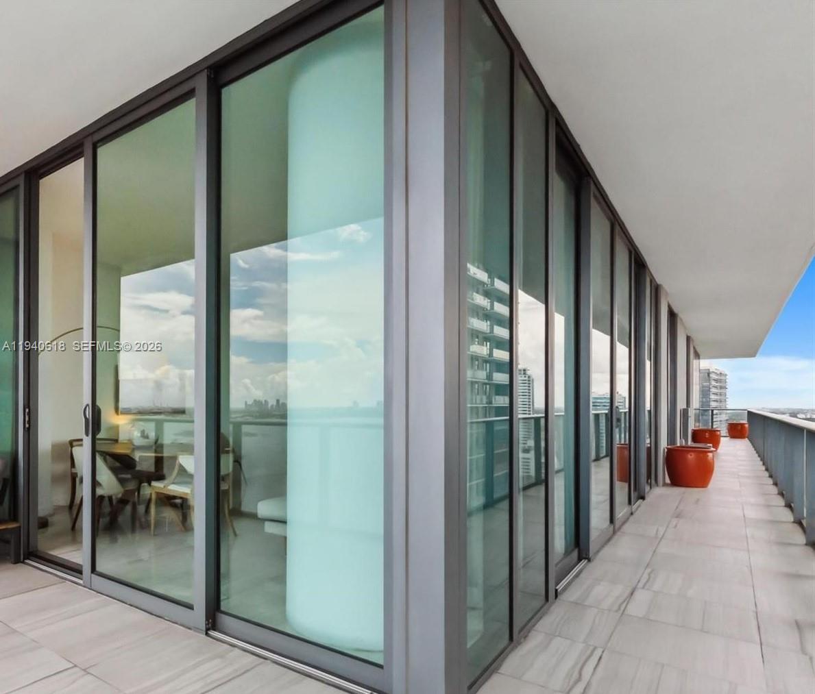 480 Northeast 31st Street, Unit 2307 Miami, FL 33137 - Photo 21 of 47 a balcony view with a glass door door