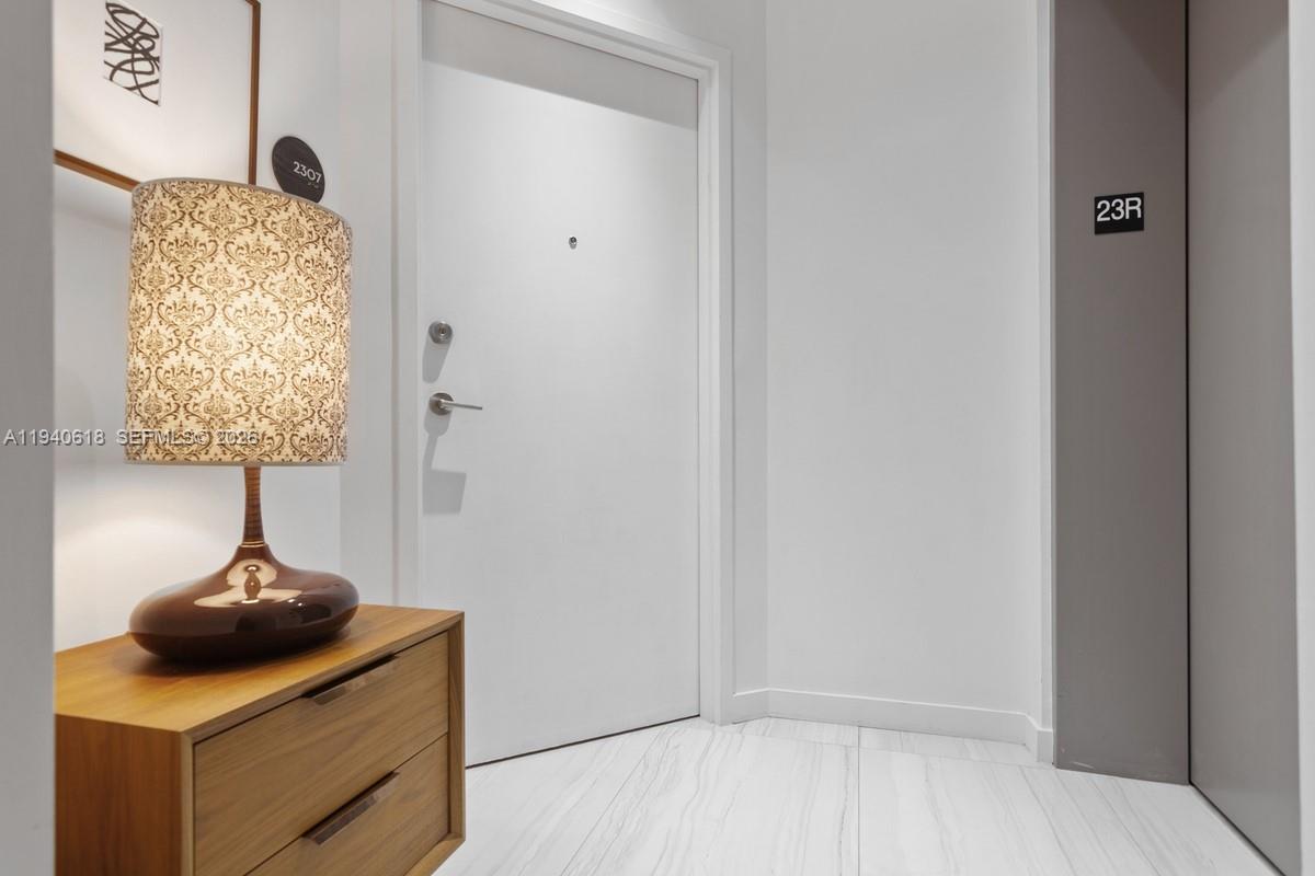 480 Northeast 31st Street, Unit 2307 Miami, FL 33137 - Photo 24 of 47 a view of hallway with washer and dryer