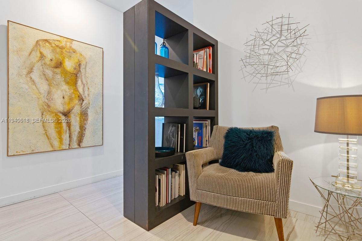 480 Northeast 31st Street, Unit 2307 Miami, FL 33137 - Photo 8 of 47 a living room with furniture and a flat screen tv