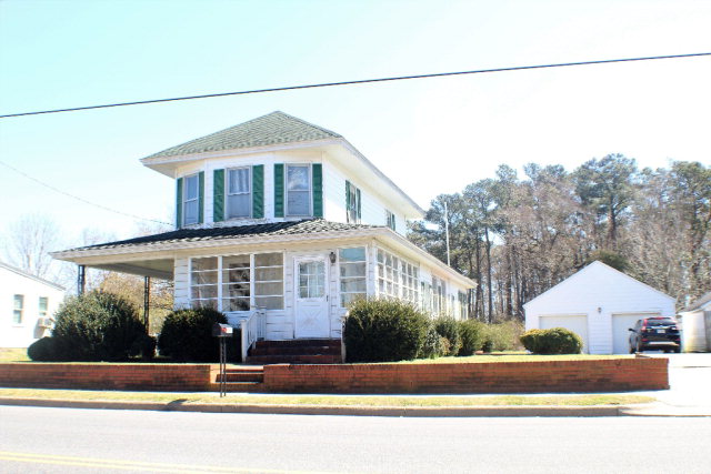 9593 Atlantic Road Atlantic, VA 23303 - Photo 1 of 20 a front view of a house with a yard