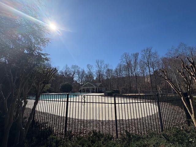 4340 Blue Ridge Drive Douglasville, GA 30135 - Photo 3 of 6 a view of roof deck with wooden fence and trees