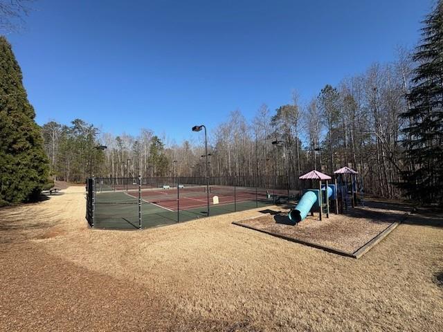 4340 Blue Ridge Drive Douglasville, GA 30135 - Photo 6 of 6 a backyard of a house with table and chairs