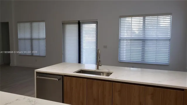 a kitchen with a sink and a window