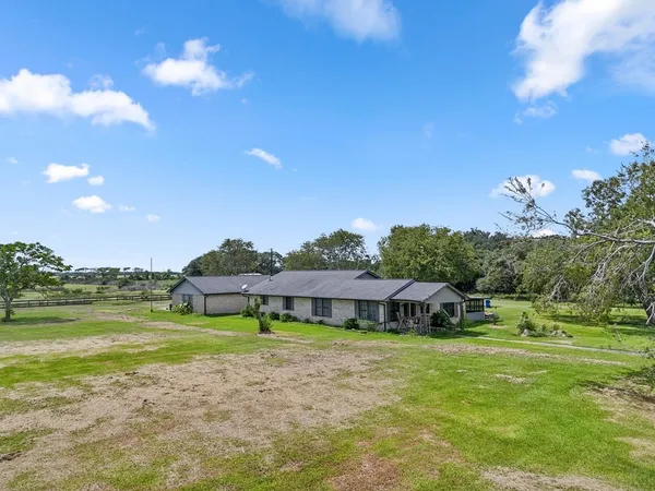 a view of a house with a big yard