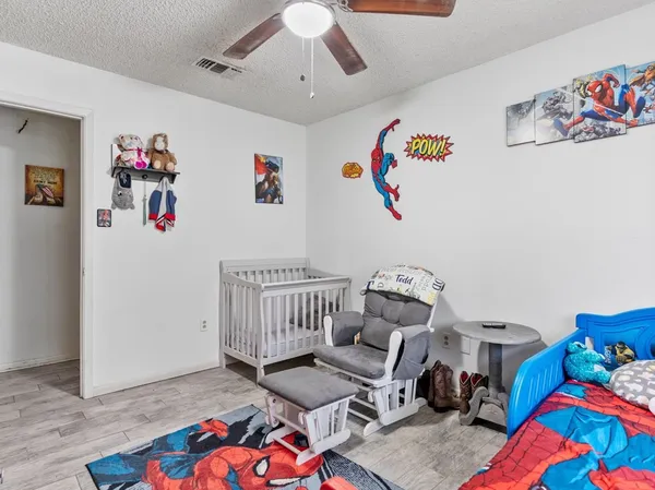 a bedroom with furniture and a couch
