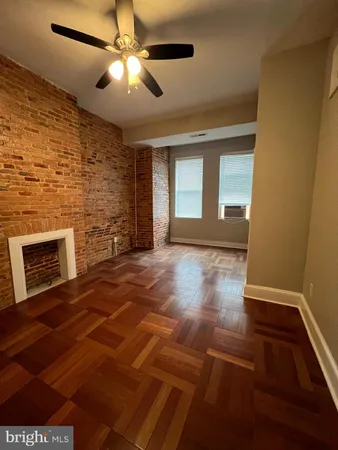 a view of livingroom with window and fireplace