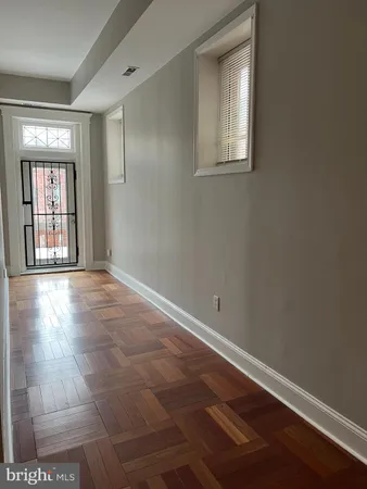 a view of an empty room with a window