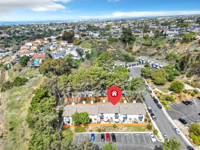 an aerial view of a tennis ground and a city view