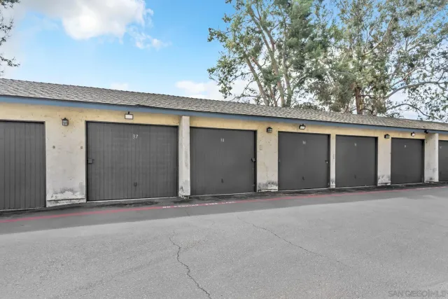 an aerial view of a house with an outdoor space