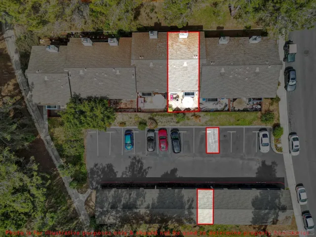 an aerial view of a houses with outdoor area