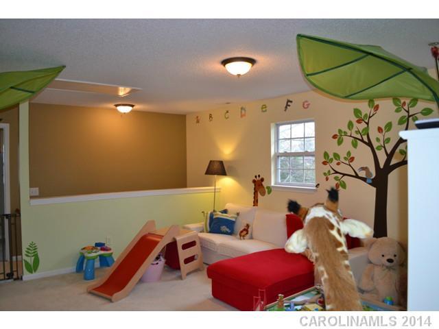 704 West Cheval Drive Fort Mill, SC 29708 - Photo 11 of 16 a bedroom with furniture and a chair