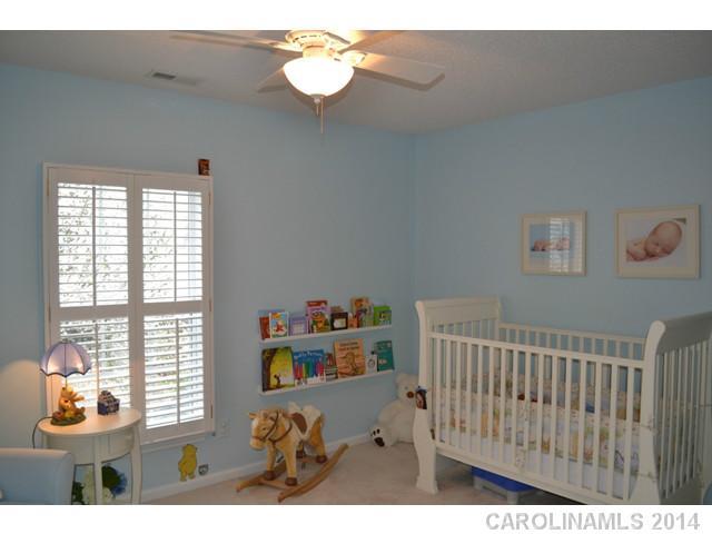 704 West Cheval Drive Fort Mill, SC 29708 - Photo 12 of 16 a bedroom with furniture and a window