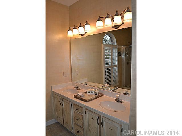 704 West Cheval Drive Fort Mill, SC 29708 - Photo 14 of 16 a bathroom with a sink and a mirror