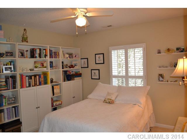 704 West Cheval Drive Fort Mill, SC 29708 - Photo 15 of 16 a bedroom with a bed furniture and a book shelf