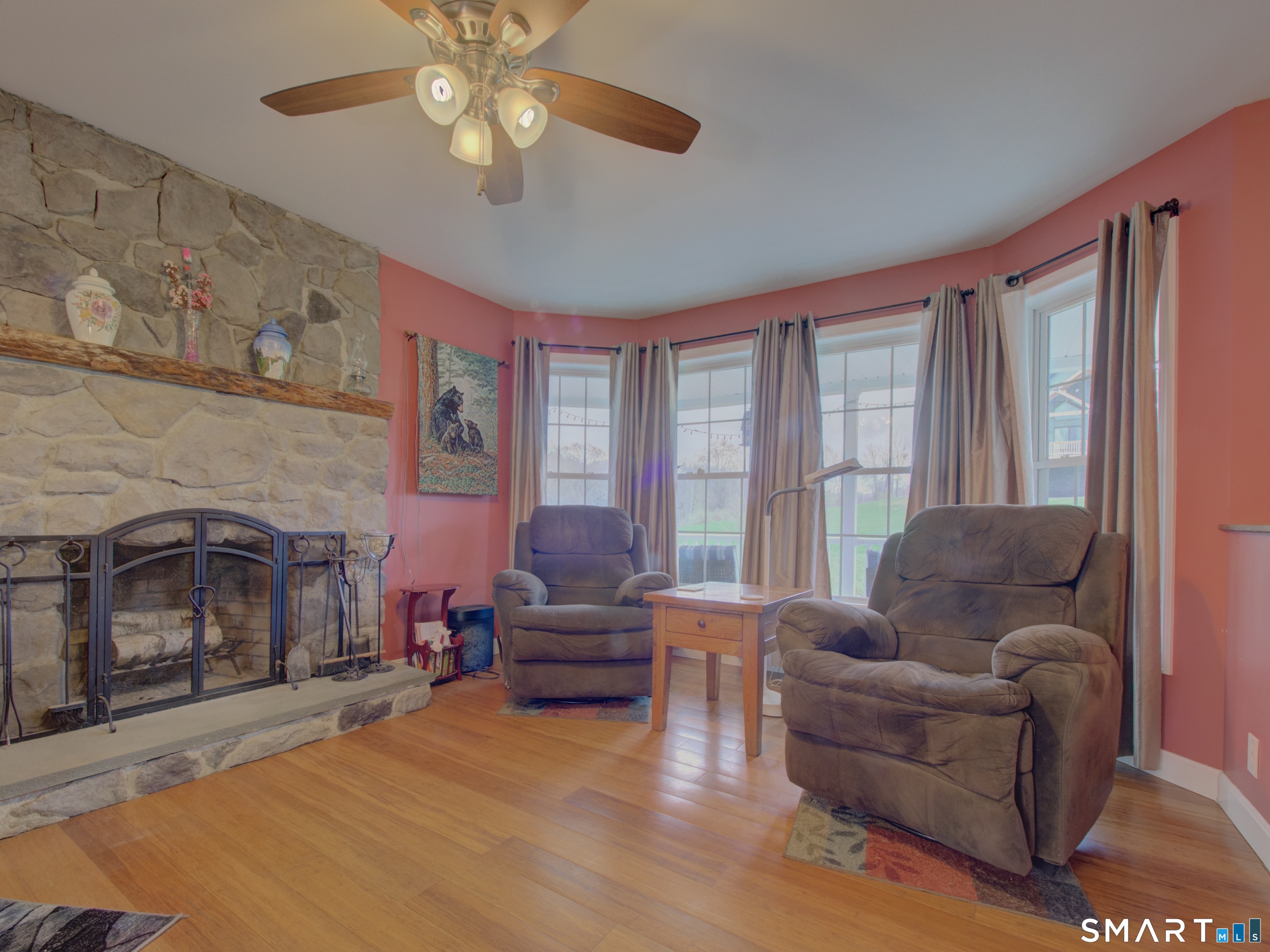 592 Ference Road Ashford, CT 06278 - Photo 7 of 33 Living room with wood burning fireplace. Door to the left holds wood and is cedar lined to deter insects.