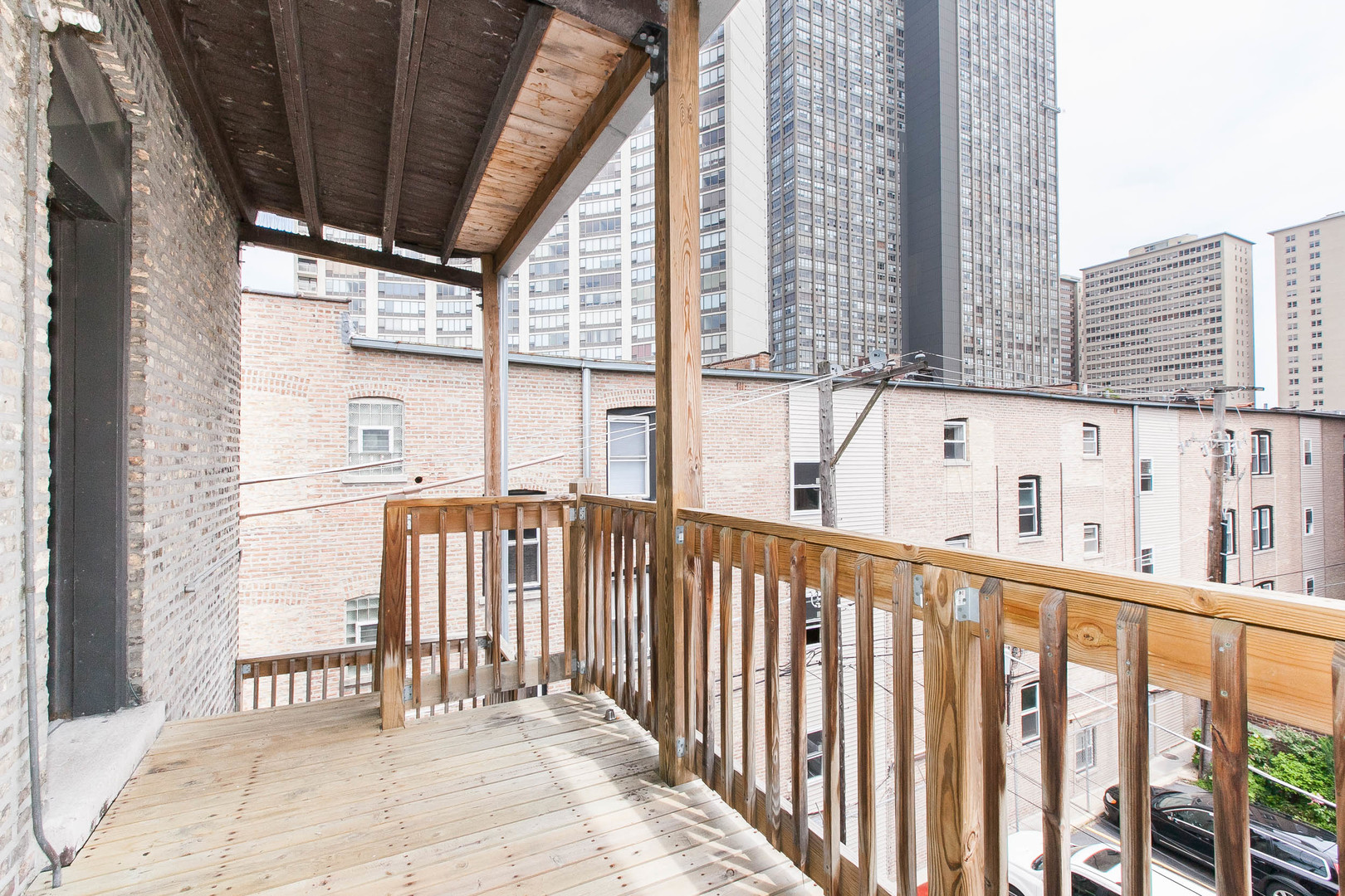 722 West Sheridan Road, Unit 3N Chicago, IL 60613 - Photo 12 of 14 a view of a balcony with wooden floor